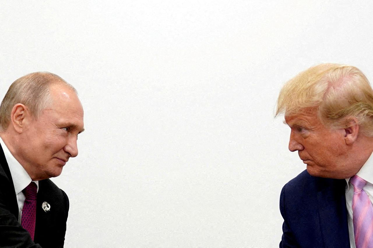 FILE PHOTO: U.S. President Donald Trump and Russian President Vladimir Putin  at G20 leaders summit in Osaka