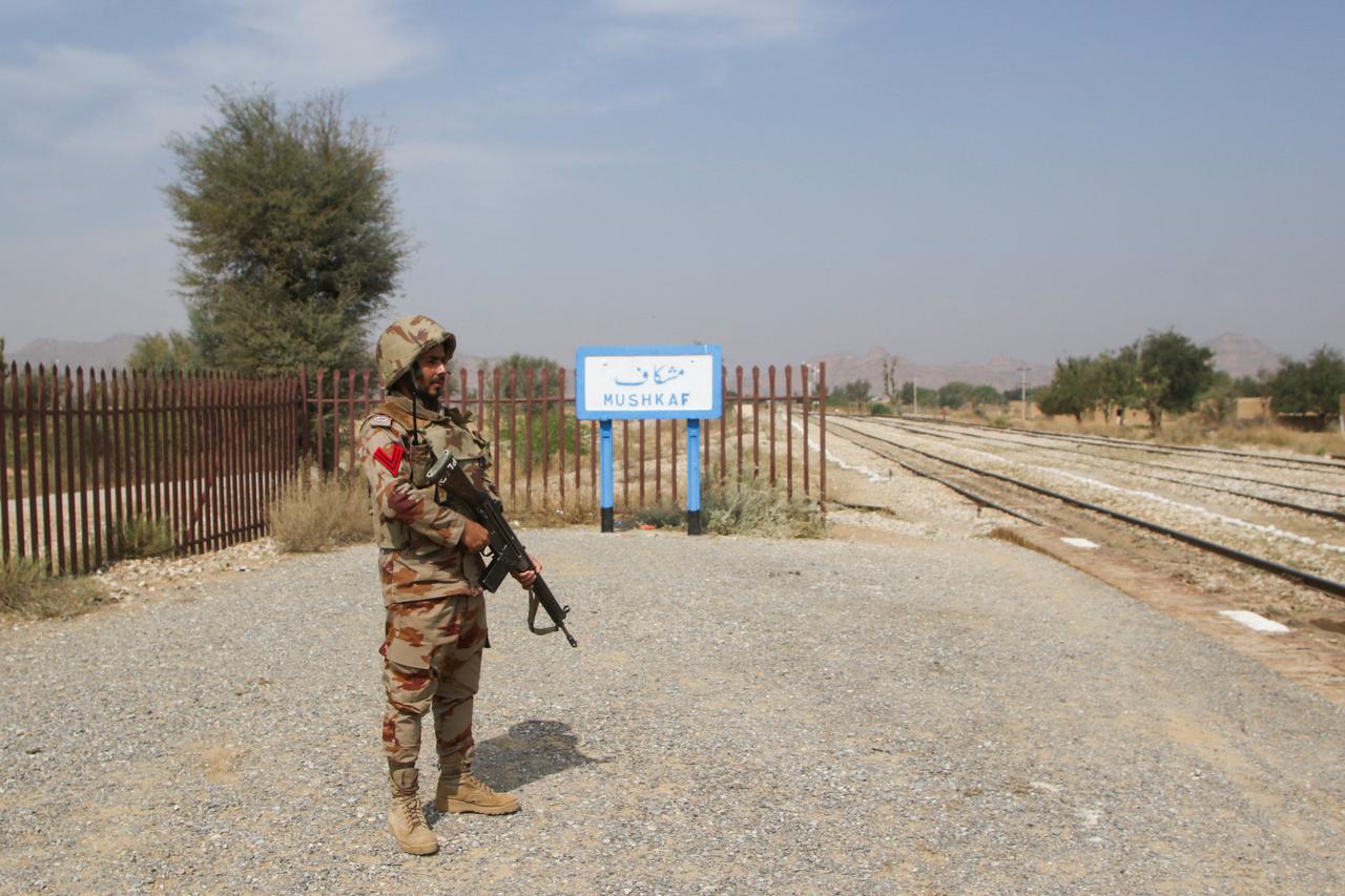 A Pakistan Army soldier stands guard, after the attack on a train by separatist militants in Bolan, at the railway station in Mushkaf